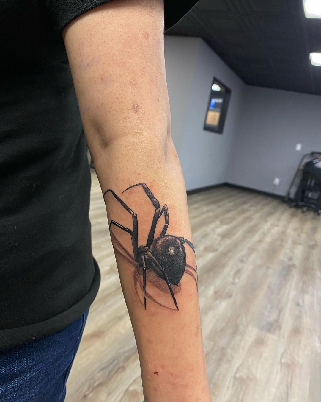Black Widow Spider Tattoo on Arms