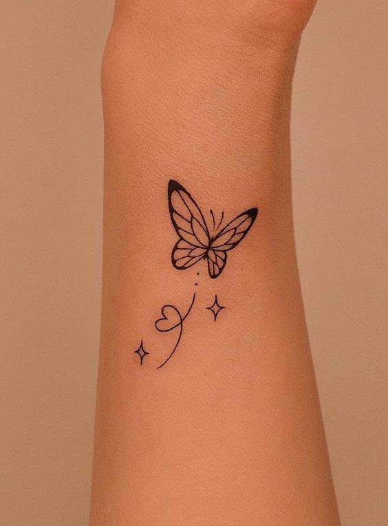 Butterfly Hand tattoo design with heart