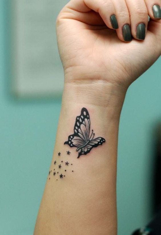 Butterfly Hand tattoo design with stars