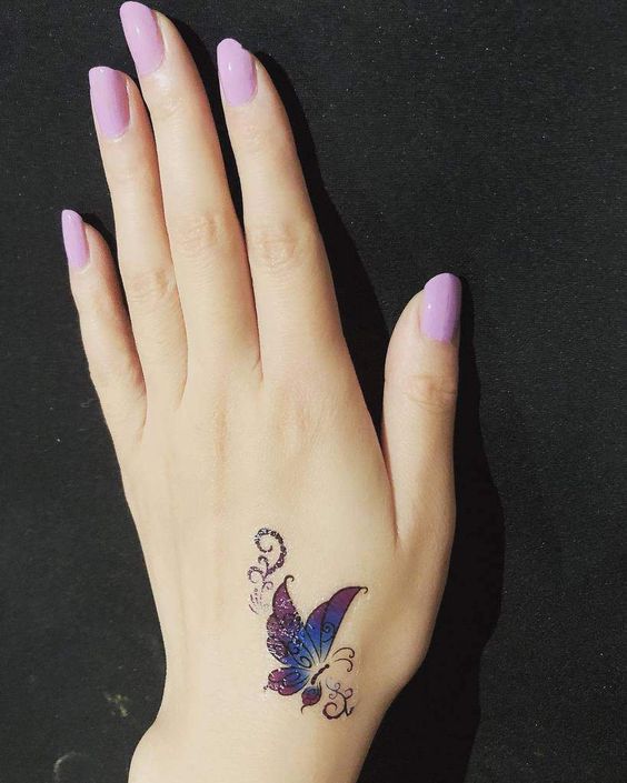 coloured Butterfly Hand tattoo design