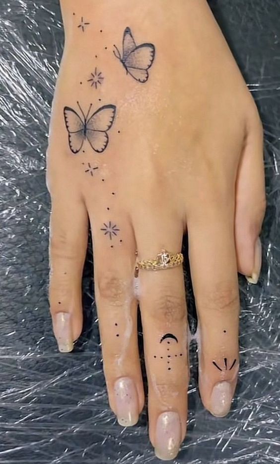 modern Butterfly Hand tattoo design