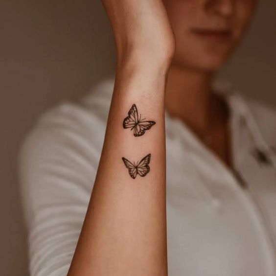 small Butterfly Hand tattoo design