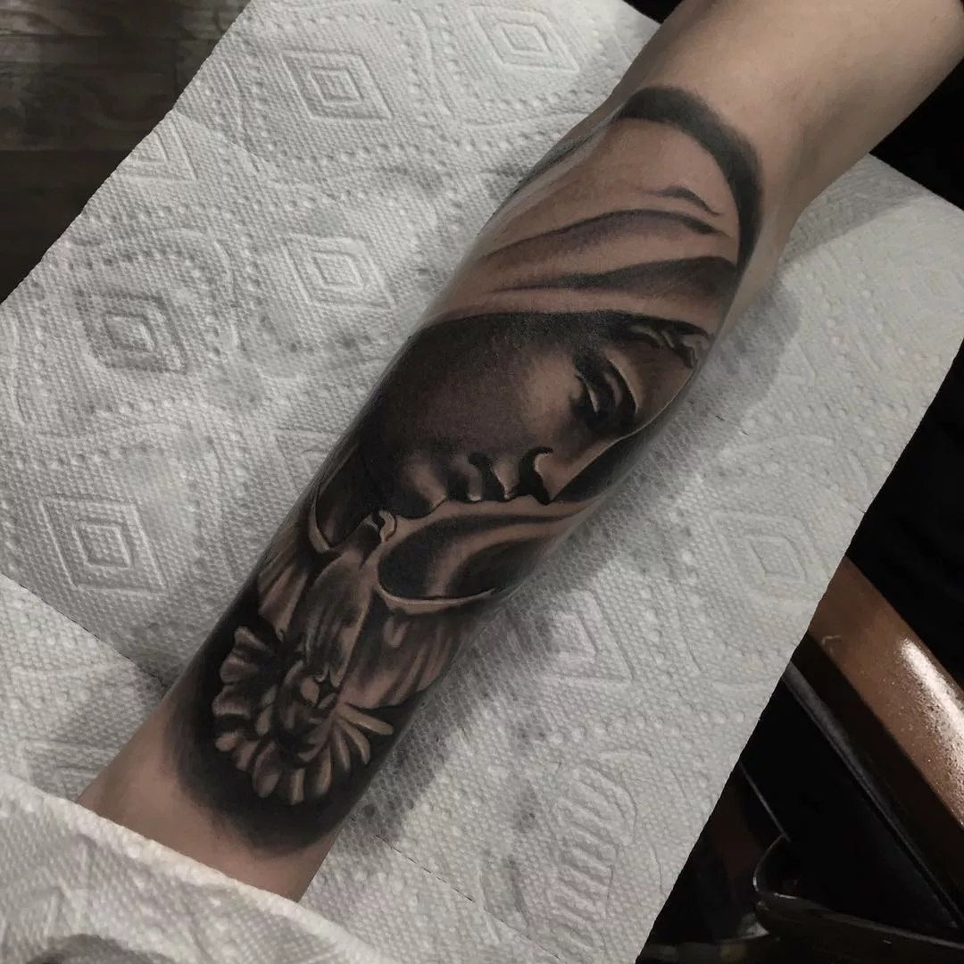 Black virgin mary tattoo