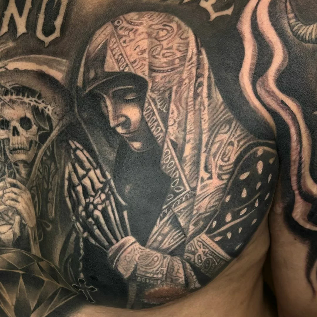 Virgin Mary X skull praying hands tattoo
