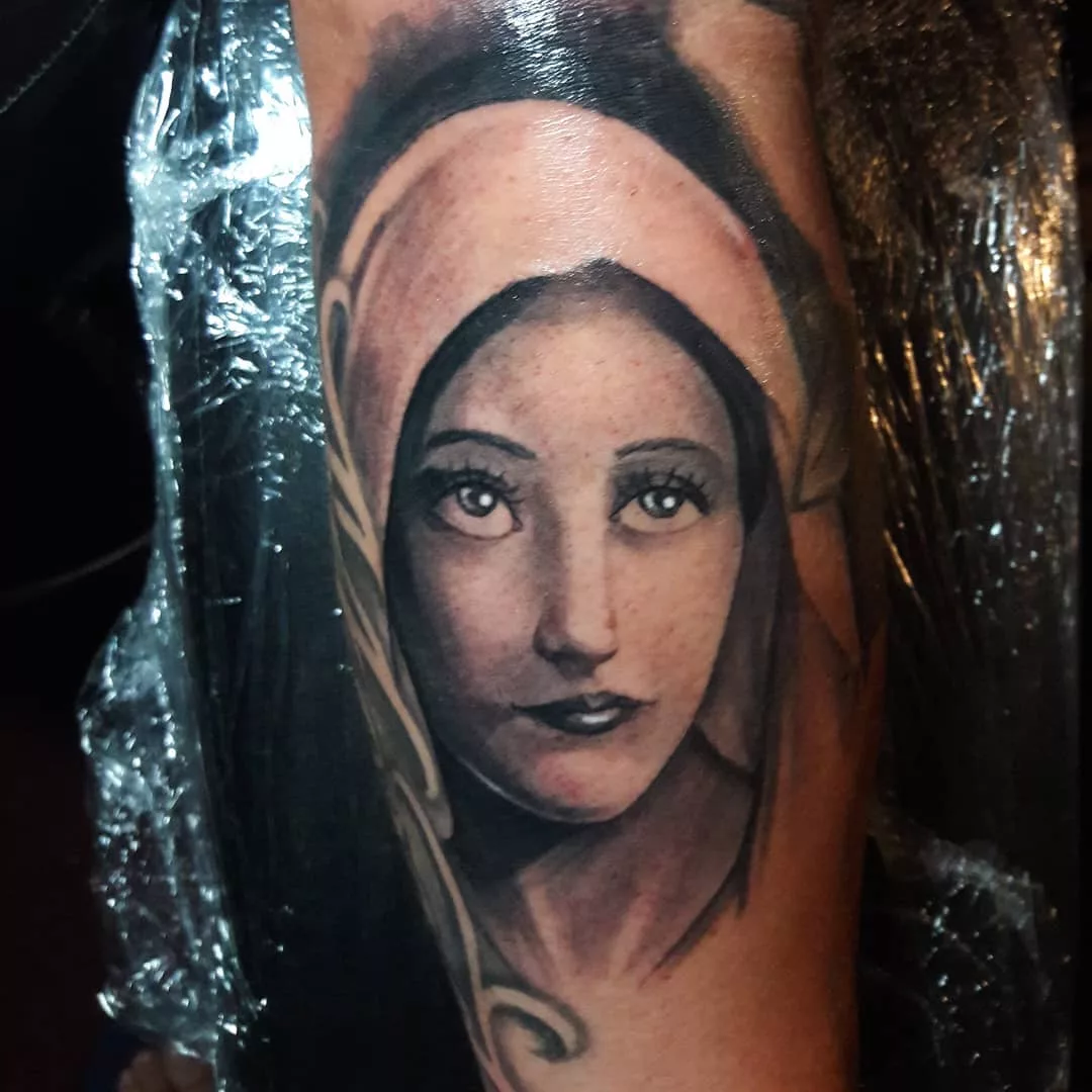 simple virgin mary tattoo