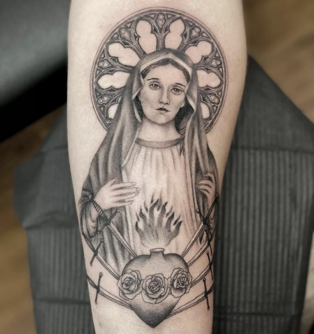 virgin mary tattoo on arm