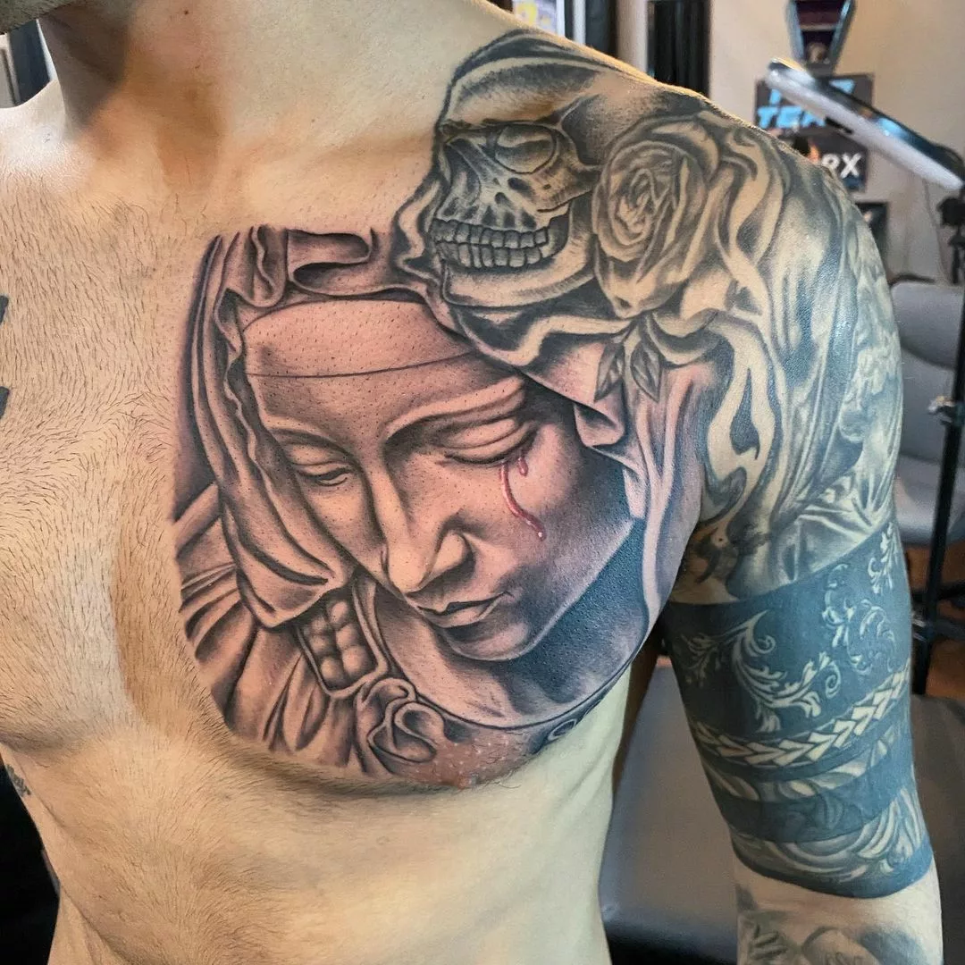 virgin mary tattoo on chest
