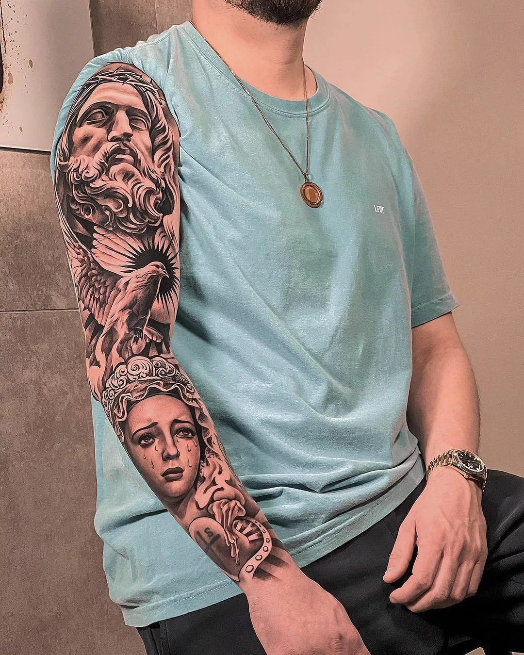 virgin mary tattoo on full arm