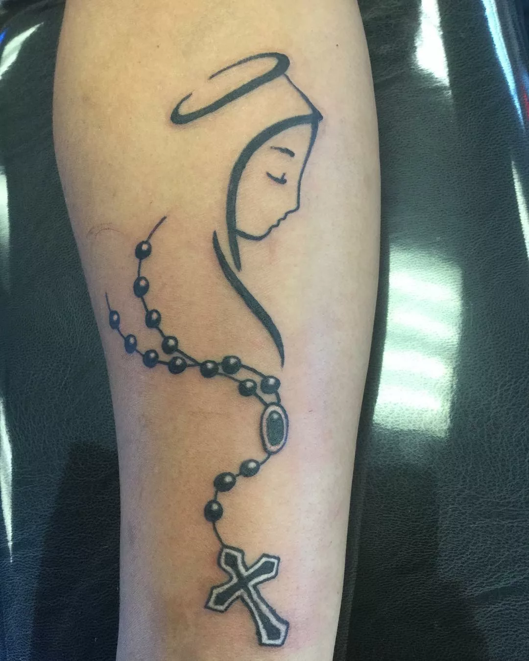 virgin mary tattoo on hand