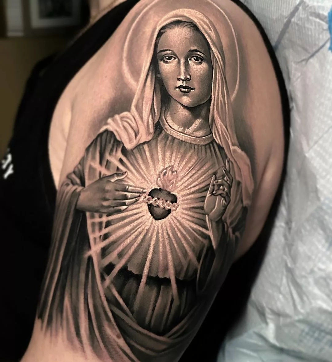 virgin mary tattoo on shoulder